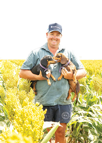 Man holding two dogs