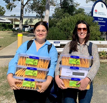 Millicent Smith and Shanice Van Haeften holding chickpea seed packets