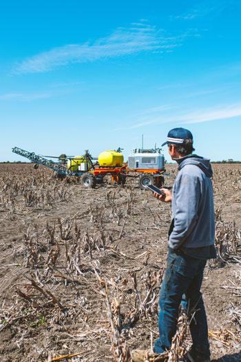 man in a field of stubble