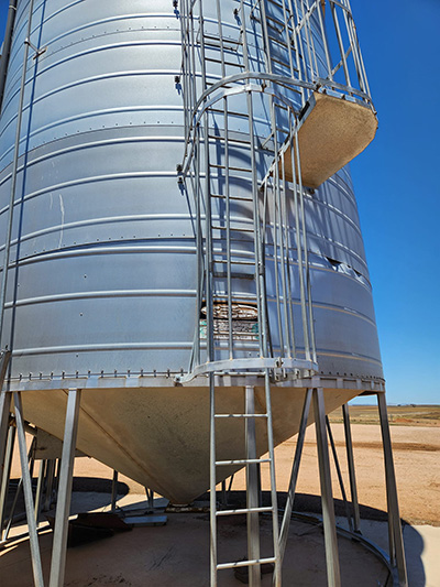 Image of grain storage silo that has been damaged or worn out and due for repair.