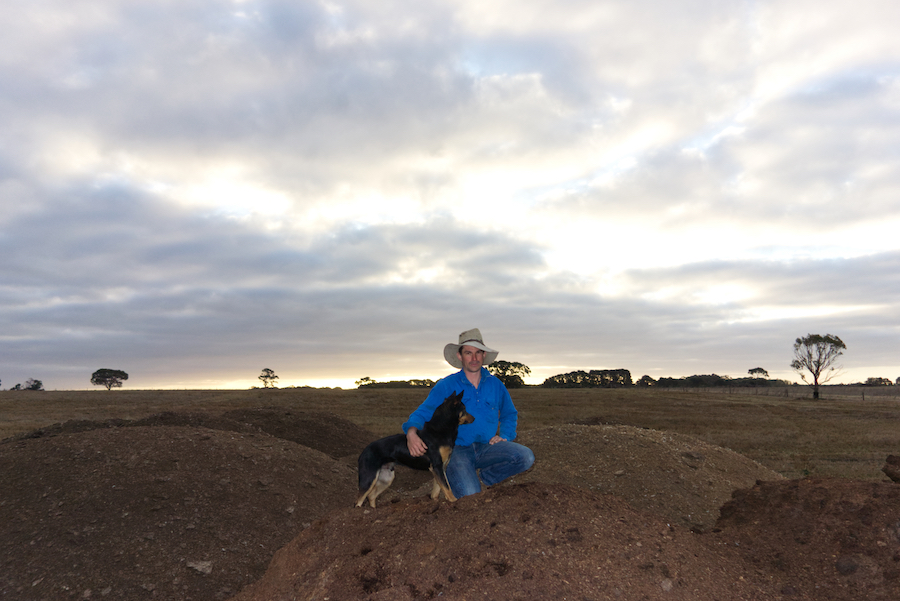 Todd Venning and Cam atop piles of manure. 