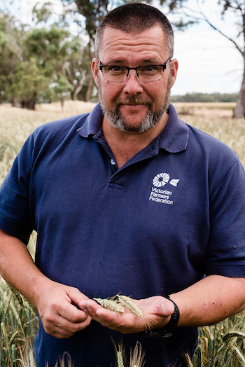 Ashley Fraser standing in a wheat paddock.
