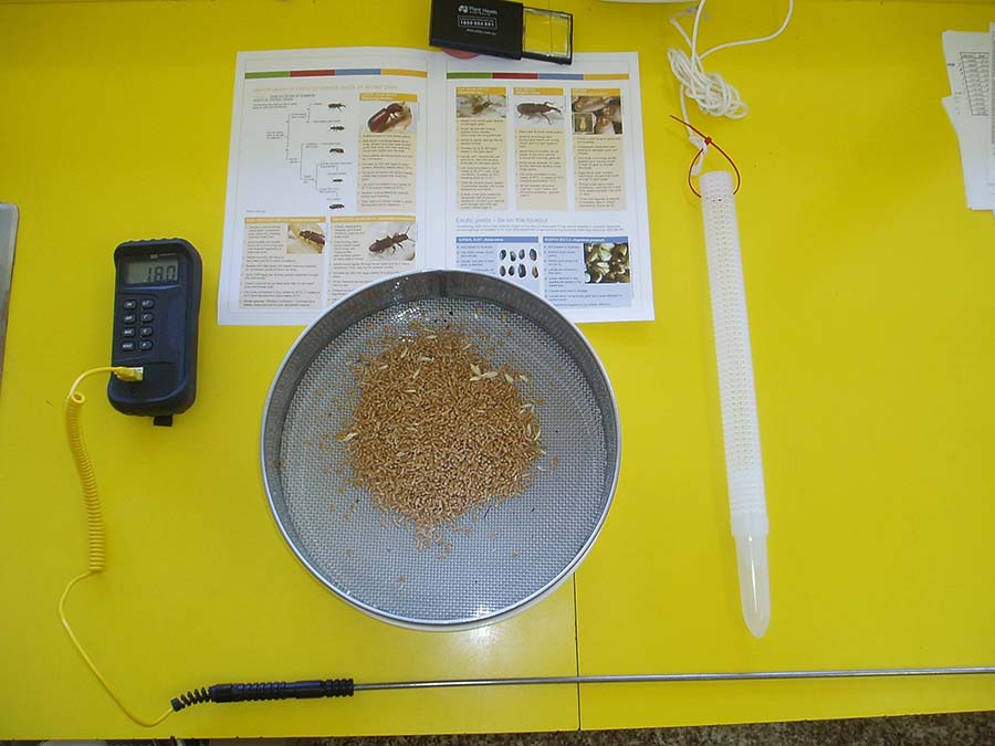 The basic tools for monitoring stored grain, from left to right: a temperature reader and attached 1.4-metre-long probe; insect sieve; and insect probe trap. At top, a GRDC insect identification guide and magnifying glass to correctly identify storage pests. PHOTO Philip Burrill
          
