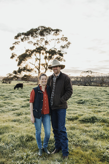 Jenny and Will Stanton in a lush paddock two years after the Ravine Fire. 