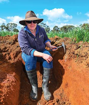 scientist sitting in the red soil