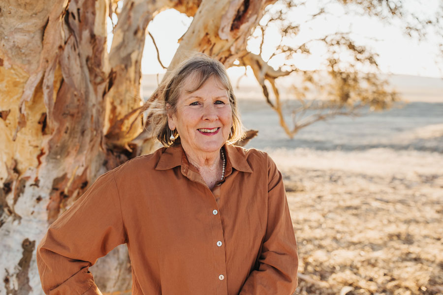 woman in brown shirt in the landscape