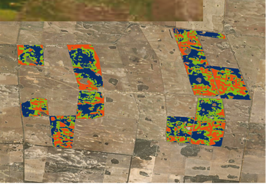 An aerial map with an overlay showing areas of paddocks with red, green and blue parts.