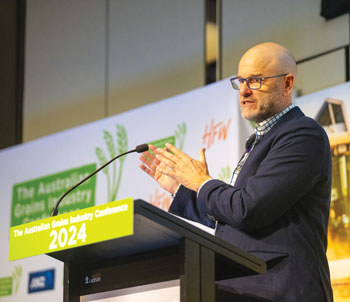 man speaking at a conference